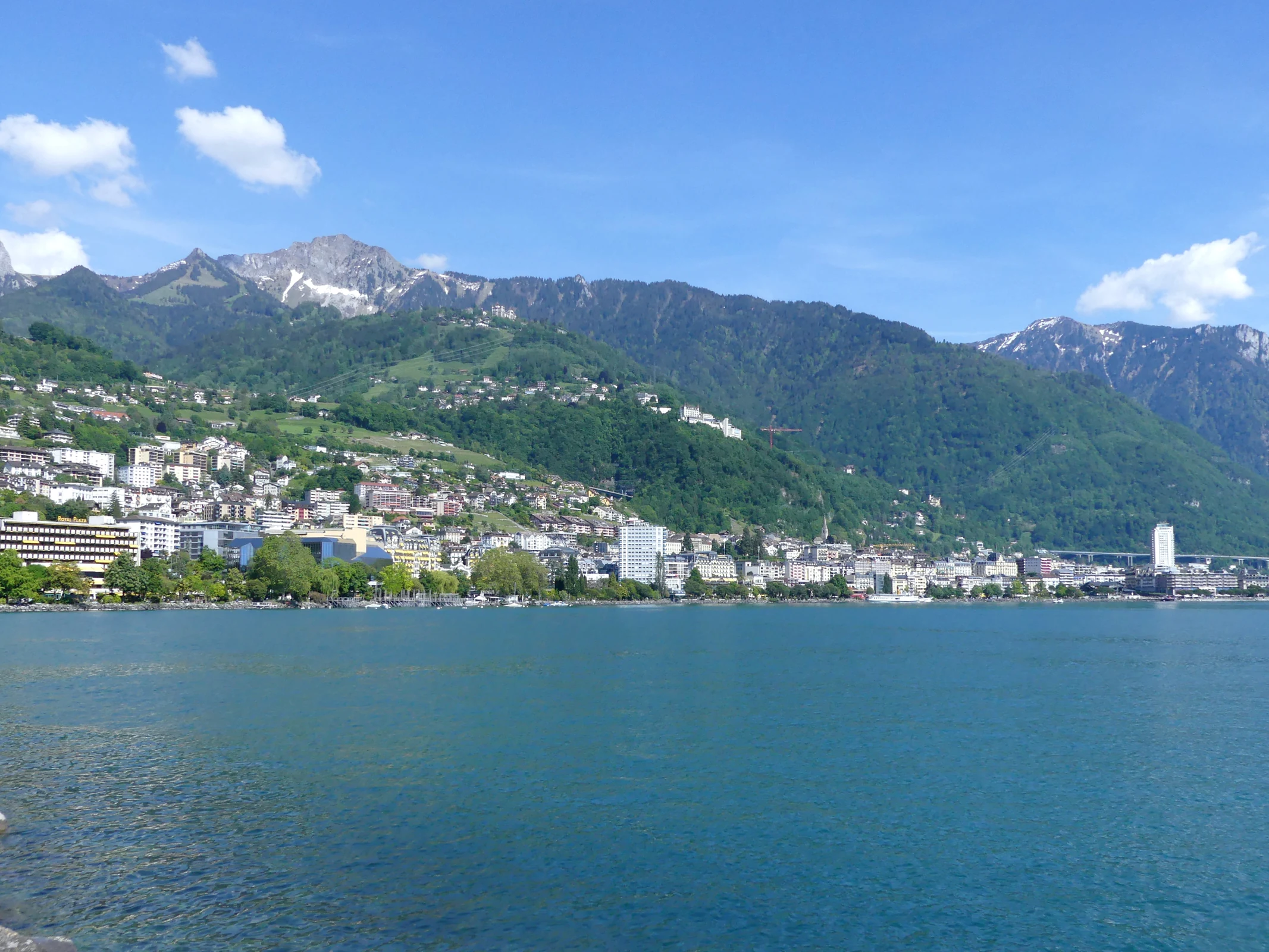 Montreux waterfront and Alpine peaks seen across Lake Geneva from Clarens